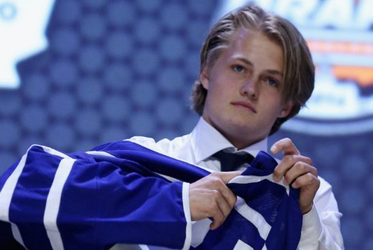 Image from: http://www.thestar.com/content/dam/thestar/sports/leafs/2014/06/27/nhl_draft_maple_leafs_pick_william_nylander/nylander_jersey.jpg.size.xxlarge.promo.jpg